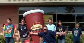 Tim Horton's Camp Day... Every penny of every cup of coffee you purchased that day at Tim Horton's went to send kids to camp- Here's CJ Morning Dude Trevor Carey and some happy campers!!
